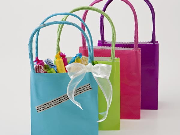 Birthday party gift bags labeled with recipients' names