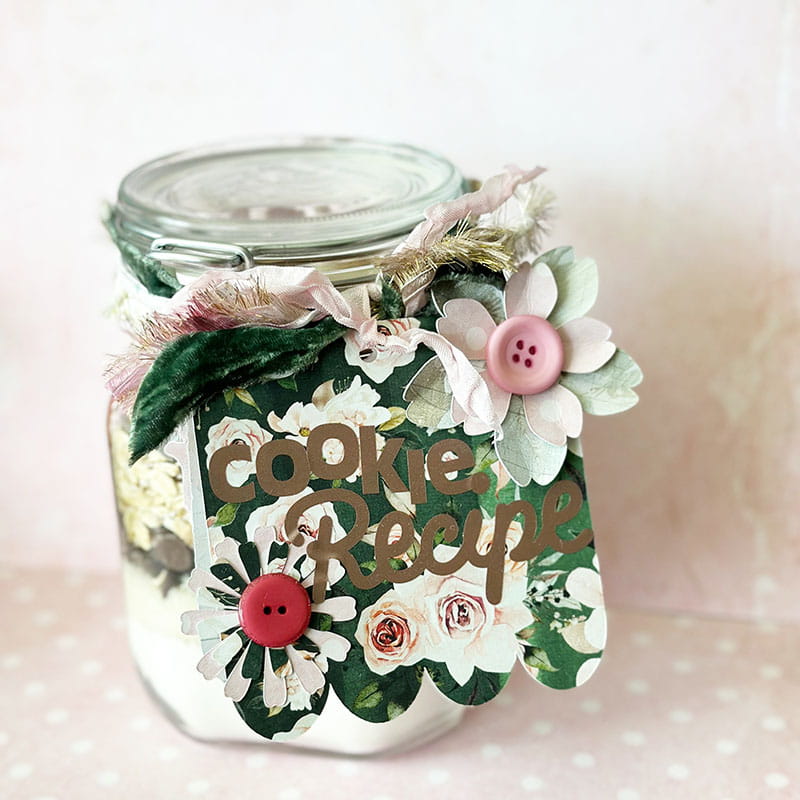 Cookie jar with white flowers on it